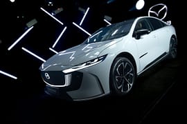 Mazda 6E displayed in a cinematic lighting environment with geometric light elements during the Mazda – Cinematic reveal of the Mazda 6E.